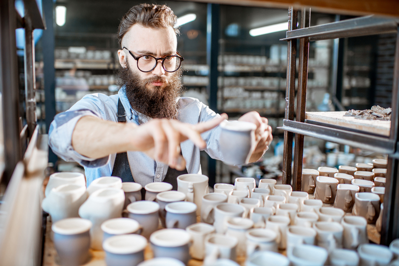 Worker at the warehouse of the pottery