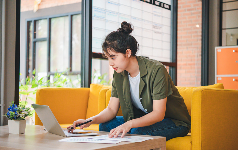 Freelancers are working on accounting and taxes on a table in a